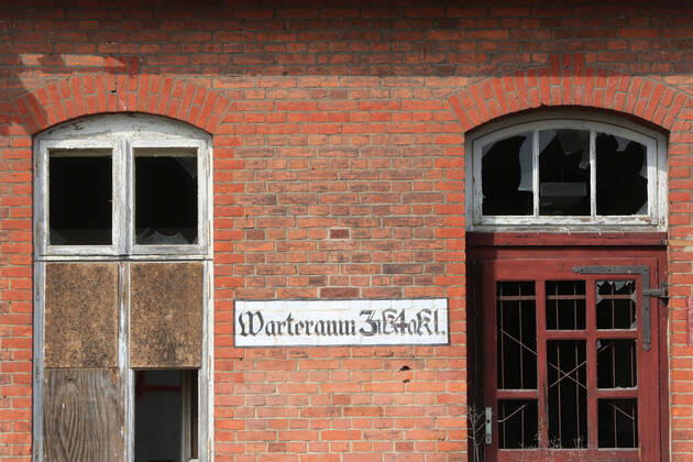 View on Saturday 30 04 2022 on the historic train station of Malchow County Mecklenburg Lake District The station has a solid basic substance Nevertheless, the decay spreads everywhere For example, grass grows in the gutters and on the paths in front of the building In addition, numerous window pa