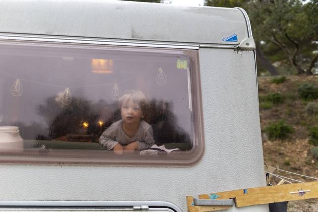 Child in rainy weather in a caravan Seget Vranjica Croatia Copyright: xUtexGrabowsky photothek.dex