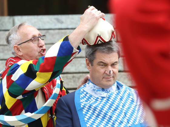 Traditional Schäfflertanz in the garden of the Bavarian State Chancellery Dr Markus Söder Soeder lets the Schäffler dance in the garden of the State Chancellery Markus Söder gets the fool cap put on, Munich Bavaria Germany garden of the State Chancellery