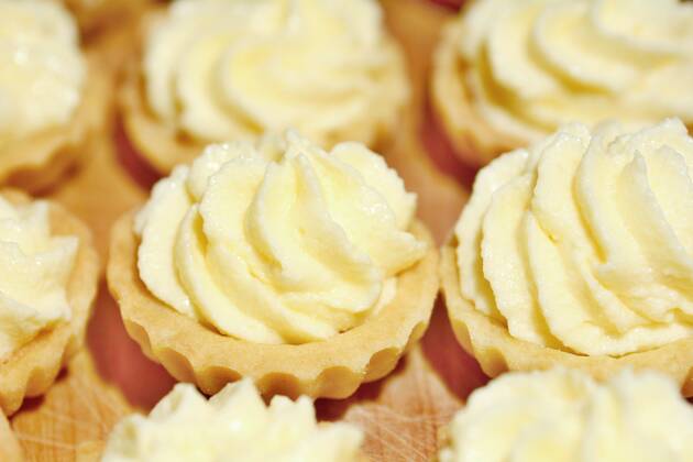 Closeup of cupcakes filled with vanilla cream. , 25100688.jpg, cream, cupcake, dessert, vanilla, cake, snack, background, food, cup, sweet, butter, confectionery, baked, celebration, delicious, swirl, birthday, decorating, decoration, epicure, treat, creamy, decorated, homemade, party, unhealthy, bakery, bakery goods, confection, cool, dairy, holiday, pudding, soft, twirl, buttercream, celebrate, fancy, nobody, cupcakes, frosting, icing,