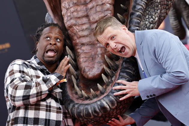 Presenter Mola Adebisi and entertainer Oliver Pocher in front of a T Rex at the German premiere of Jurassic World A New Age at the Cinedom cinema Cologne, 30 05 2022 NRW Germany Copyright: xChristophxHardtx