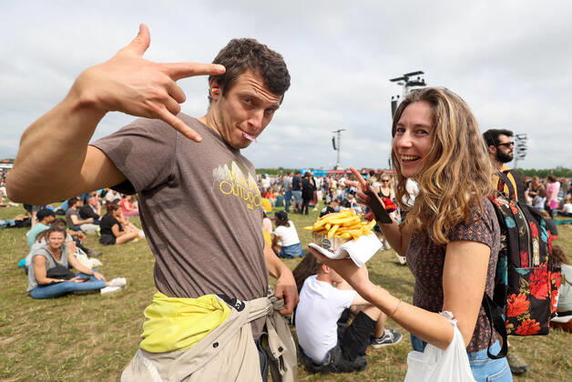 Illustration picture shows festival goers eating fries (frietjes-frites) at the 20th edition of the TW Classic music festival in Werchter, Sunday 19 June 2022.  VIRGINIExLEFOUR 36634317