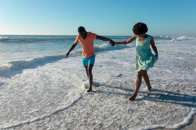 Creative Highlights Symbolbilder African american couple holding hands wading on shore at beach against sky during sunny day African american couple holding hands wading on shore at beach against sky during sunny day. unaltered, lifestyle, love, togetherness and holiday concept., model released, , property released, Cape Town, South Africa, , 3137198.jpg, people,african american,couple,holding hand,wading,shore,beach,sky,sunny day,unaltered,lifestyle,love,togetherness,holiday concept,coast,sea,ocean,vacation,sand,summer,travel,landscape,together,water,happy,young,outdoor,beautiful,nature,coastline,tourism,leisure,sun,relationship,african,american,holding,hand,sunny,day,holiday,concept Young Adult,Man,Male,Black,Woman,Female