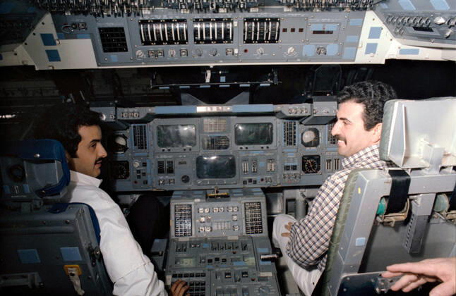 S85-29788 (May 1985) --- Sultan Salman Abdelazize Al-Saud and Abdulmohsen Hamad Al-Bassam man the controls on the flight deck of the crew compartment trainer (CCT) in the Shuttle mockup and integration laboratory at the Johnson Space Center (JSC). Copyright: xpiemagsx piemagsspace-2524 !ACHTUNG AUFNAHMEDATUM GESCHÄTZT!