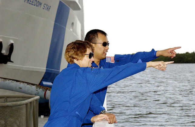 KENNEDY SPACE CENTER, FLA. - While touring the SRB Retrieval Ship Freedom Star, STS-114 Commander Eileen Collins and Mission Specialist Soichi Noguchi point at something on the Banana River. Noguchi is with the Japanese space agency NASDA. The ships routinely are docked at Hangar AF on the river. On their mission, the crew - which also includes Pilot James Kelly and Mission Specialist Stephen Robinson - will carry the MultiPurpose Logistics Module (MPLM) Raffaello and External Stowage Platform 2 to the International Space Station. The MPLM will contain supplies and equipment. Another goal of the mission is to remove and replace a Control Moment Gyro. Launch date for mission STS-114 is under review. Copyright: xpiemagsx piemagsspace-27032 !ACHTUNG AUFNAHMEDATUM GESCHÄTZT!