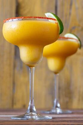  Frozen Mango Margarita cocktails, Glasses of Frozen Mango Margarita cocktails garnished with paprika salt rim, Glasses of Frozen Mango Margarita cocktails garnished with paprika salt rim, 10.09.2020, Copyright: xAlex9500x Panthermedia28833050.jpg