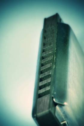 Close up of blues harmonica , shallow DOF retro style toned photo , 4030914.jpg, aged, audio, band, blow, blues, brass, country, diatonic, draw, folk, harmonica, harp, instrument, instruments, isolated, jazz, metal, mouth, music, note, object, old, plate, pop, reed, retro, rock, studio, toned, used, vertical, vintage,