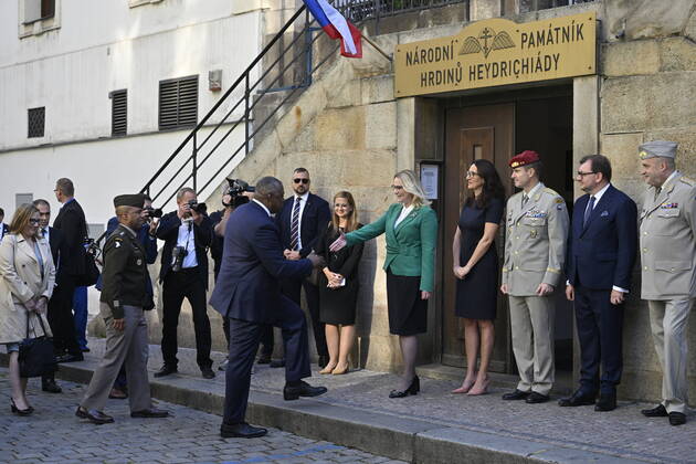 U.S. Secretary of Defense Lloyd Austin, left, shakes hands with Czech Defence Minister Jana Cernochova before a homage to the Czechoslovak paratroopers who killed Nazi Deputy Reichsprotector Reinhard Heydrich, Friday, Sept. 9, 2022, the Saint Cyril and Methodius Church, Prague, Czech Republic. (CTKxPhoto VitxSimanek) CTKPhotoP2022090902724