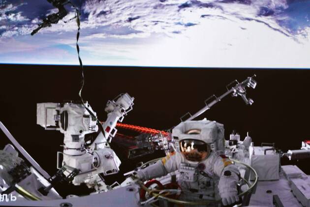 (220917) -- BEIJING, Sept. 17, 2022 -- Screen image captured at Beijing Aerospace Control Center on Sept. 17, 2022 shows Shenzhou-14 astronaut Cai Xuzhe exiting the space station lab module Wentian to conduct extravehicular activities (EVAs). China s Shenzhou-14 astronauts Cai Xuzhe and Chen Dong successfully exited the space station lab module Wentian on Saturday to conduct EVAs, according to the China Manned Space Agency (CMSA). ) (EyesonSci)CHINA-WENTIAN-SHENZHOU-14 ASTRONAUTS-EXTRAVEHICULAR ACTIVITIES (CN) GuoxZhongzheng 