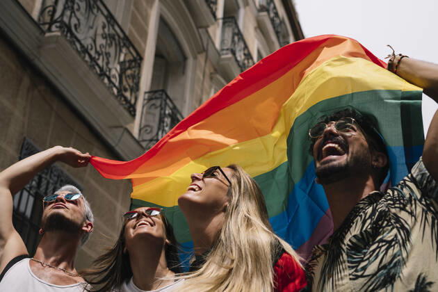 Group of friends with a flag of gay pride in the city of Madrid JoseLuisCarrascosa_GayPride_17 Copyright: xJosexLuisxCarrascosax Model Released