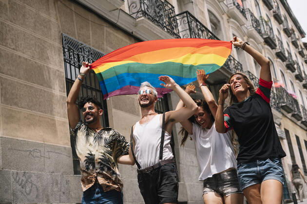 Group of friends with a flag of gay pride in the city of Madrid JoseLuisCarrascosa_GayPride_7 Copyright: xJosexLuisxCarrascosax Model Released