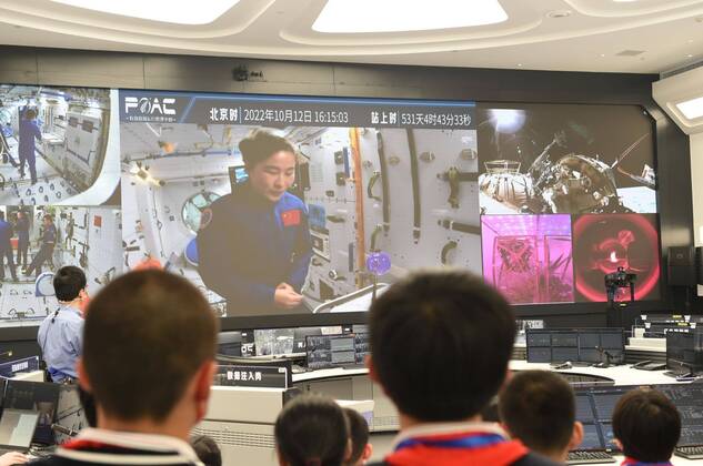 (221012) -- BEIJING, Oct. 12, 2022 -- Students attend the third live class of the Tiangong Class series at the Technology and Engineering Center for Space Utilization of the Chinese Academy of Sciences in Beijing, capital of China, Oct. 12, 2022. The third live class from China s space station was held Wednesday afternoon, delivered by Shenzhou-14 crew members Chen Dong, Liu Yang and Cai Xuzhe to students on Earth. The main classroom is located at the Technology and Engineering Center for Space Utilization, Chinese Academy of Sciences. The class is also being attended by students from other three classrooms in Yunnan, Henan, and Shandong. It is the first science lecture from the Wentian lab module. ) CHINA-SPACE STATION-THIRD LIVE C