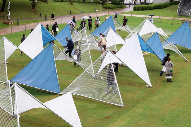 October 14, 2022, Tokyo, Japan - A large installation Sea Hammock formed by tarps and fishnets created by Japanese architect Yuko Nagayama is displayed on the lawn field as a part of the Tokyo Midtown Design Touch 2022 in Tokyo on Friday, October 14, 2022. An annual design event with the theme of Design for Sustainable Future started at the Tokyo Midtown through November 3.  , aflo_201255364.jpg,