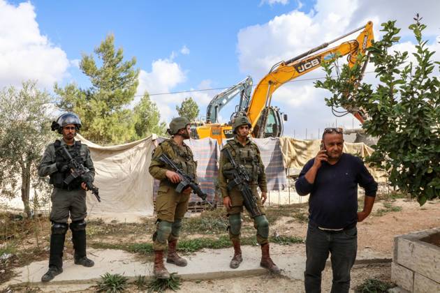 Israeli bulldozers demolish two Palestinian-owned houses in the village of al-Walaja, northwest of the West Bank city of Bethlehem Israeli bulldozers demolish two Palestinian-owned houses in the village of al-Walaja, northwest of the West Bank city of Bethlehem, Palestinain sources confirmed on November 2, 2022. Israeli forces raided the said village and demolished a house owned by local resident Othman al-Shweiki, and demolished another house owned by resident Khitam Ridwan. Photo by Ahmad Tayem APAimages Bethlehem West Bank Palestinian Territory 021122_Bethlehem_AT_00 (21) Copyright: xapaimagesxAhmadxTayemx xapaimagesx