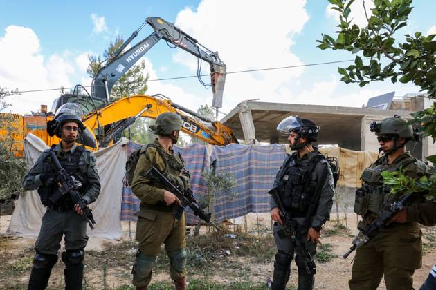 Israeli bulldozers demolish two Palestinian-owned houses in the village of al-Walaja, northwest of the West Bank city of Bethlehem Israeli bulldozers demolish two Palestinian-owned houses in the village of al-Walaja, northwest of the West Bank city of Bethlehem, Palestinain sources confirmed on November 2, 2022. Israeli forces raided the said village and demolished a house owned by local resident Othman al-Shweiki, and demolished another house owned by resident Khitam Ridwan. Photo by Ahmad Tayem APAimages Bethlehem West Bank Palestinian Territory 021122_Bethlehem_AT_00 (12) Copyright: xapaimagesxAhmadxTayemx xapaimagesx