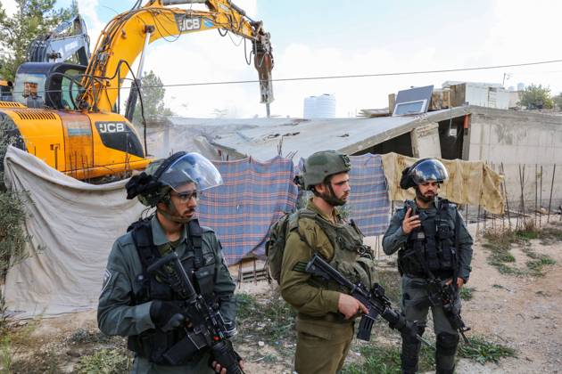 Israeli bulldozers demolish two Palestinian-owned houses in the village of al-Walaja, northwest of the West Bank city of Bethlehem Israeli bulldozers demolish two Palestinian-owned houses in the village of al-Walaja, northwest of the West Bank city of Bethlehem, Palestinain sources confirmed on November 2, 2022. Israeli forces raided the said village and demolished a house owned by local resident Othman al-Shweiki, and demolished another house owned by resident Khitam Ridwan. Photo by Ahmad Tayem APAimages Bethlehem West Bank Palestinian Territory 021122_Bethlehem_AT_00 (15) Copyright: xapaimagesxAhmadxTayemx xapaimagesx
