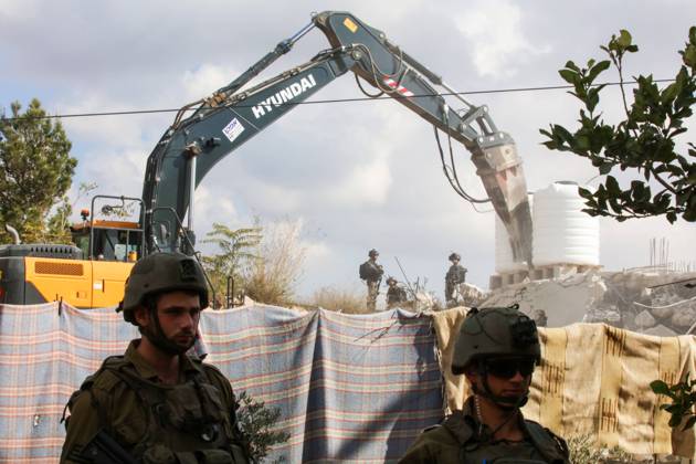 Israeli bulldozers demolish two Palestinian-owned houses in the village of al-Walaja, northwest of the West Bank city of Bethlehem Israeli bulldozers demolish two Palestinian-owned houses in the village of al-Walaja, northwest of the West Bank city of Bethlehem, Palestinain sources confirmed on November 2, 2022. Israeli forces raided the said village and demolished a house owned by local resident Othman al-Shweiki, and demolished another house owned by resident Khitam Ridwan. Photo by Ahmad Tayem APAimages Bethlehem West Bank Palestinian Territory 021122_Bethlehem_AT_00 (19) Copyright: xapaimagesxAhmadxTayemx xapaimagesx