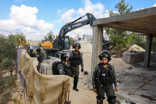 Israeli bulldozers demolish two Palestinian-owned houses in the village of al-Walaja, northwest of the West Bank city of Bethlehem Israeli bulldozers demolish two Palestinian-owned houses in the village of al-Walaja, northwest of the West Bank city of Bethlehem, Palestinain sources confirmed on November 2, 2022. Israeli forces raided the said village and demolished a house owned by local resident Othman al-Shweiki, and demolished another house owned by resident Khitam Ridwan. Photo by Ahmad Tayem APAimages Bethlehem West Bank Palestinian Territory 021122_Bethlehem_AT_00 (6) Copyright: xapaimagesxAhmadxTayemx xapaimagesx