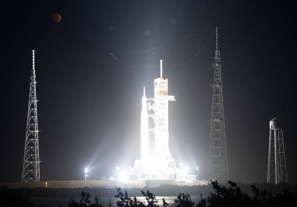 The Moon is seen during a total lunar eclipse above NASA?s Artemis I mission s Space Launch System (SLS) rocket with the Orion spacecraft aboard atop a mobile launcher at Launch Pad 39B, Tuesday, Nov. 8, 2022, at NASA?s Kennedy Space Center in Florida. NASA?s Artemis I flight test is the first integrated test of the agency?s deep space exploration systems: the Orion spacecraft, SLS rocket, and supporting ground systems. Where: Kennedy Space Center, Florida, United States When: 08 Nov 2022 Credit: NASA Joel Kowsky Cover Images **EDITORIAL USE ONLY. MATERIALS ONLY TO BE USED IN CONJUNCTION WITH EDITORIAL STORY. THE USE OF THESE MATERIALS FOR ADVERTISING, MARKETING OR ANY OTHER COMMERCIAL PURPOSE IS STRICTLY PROHIBITED. MATERIAL COPY Copyright: xNASA JoelxKowskyx 52161060 EDITORIAL USE ONLY. NOT FOR USE BY NEWSPAPERS BASED IN THE UK.