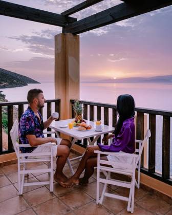 table and chairs with breakfast during sunrise at the meditarian sea in Greece table and chairs with breakfast during sunrise at the meditarian sea in Greece. Couple having breakfast on balcony looking out over the ocean Copyright: xZoonar.com FOKKExBAARSSENx 16174256 ,model released, Symbolfoto ,property released