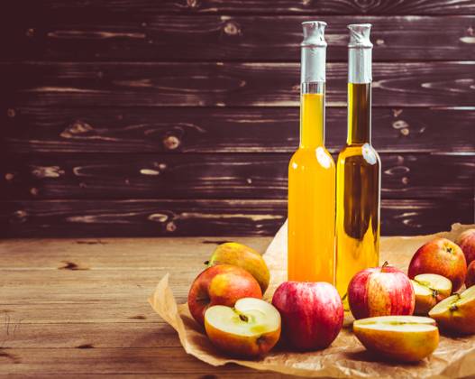 Apple juice with apple vinegar in bottles and fresh apples on wooden background Apple juice with apple vinegar in bottles and fresh apples on wooden background Copyright: xZoonar.com IngridxBalabanovax 17020535