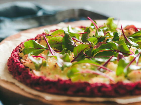 beetroot pizza crust with fresh mangold leaves beetroot pizza crust with fresh swiss chard or mangold, beetroot leaves. Ideas and recipes for vegan snack.Egg-free pizza crust with chia seeds and wholegrain brown rice flour. Copy space. Shallow DOF Copyright: xZoonar.com OlgaxSergeevax 16389492