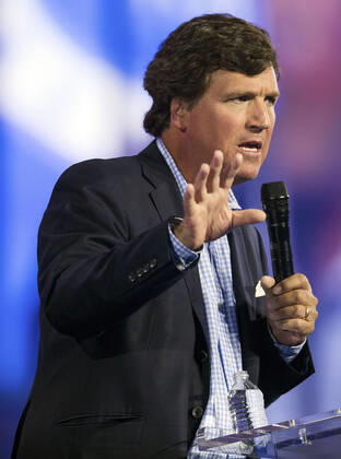 December 17, 2022 - Phoenix, Arizona, USA - Fox News host TUCKER CARLSON speaks at Turning Point USA s AmericaFest 2022. Phoenix USA - ZUMAce6_ 20221217_zaf_ce6_004 Copyright: xBrianxCahnx