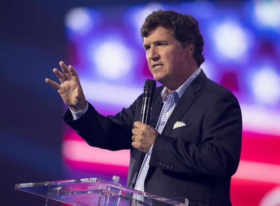December 17, 2022 - Phoenix, Arizona, USA - Fox News host TUCKER CARLSON speaks at Turning Point USA s AmericaFest 2022. Phoenix USA - ZUMAce6_ 20221217_zaf_ce6_013 Copyright: xBrianxCahnx