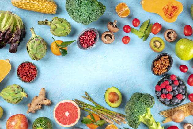 Vegan food. Healthy diet concept. Fruits, vegetables, pasta, nuts, legumes, mushrooms, shot from above on a blue background, forming a frame with a place for text. A flat lay composition Vegan food. Healthy diet concept. Fruits, vegetables, pasta, nuts, legumes, mushrooms, shot from above on a blue background, forming a frame with a place for text. A flat lay composition Copyright: xZoonar.com KaterinaxSolovyevax 14781572