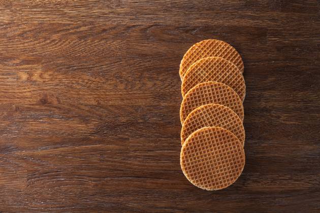 Waffles with caramel on wood Waffles with caramel on wooden background. Top view Copyright: xZoonar.com IaroslavxDanylchenkox 7984216