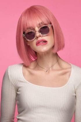 IMAGO Creative, Lifestyle, Barbiecore  Beautiful funny cute woman in pink wig and classic makeup. Beauty face., Beautiful funny cute woman in pink wig and classic makeup. The portrait was shot in a studio on a pink background. Beauty face., Beautiful funny cute woman in pink wig and classic makeup. The portrait was shot in a studio on a pink background. Beauty face. model released, Symbolfoto , 24.01.2023, Copyright: xKobrinphotox Panthermedia33524763.jpg