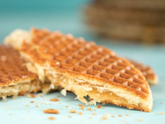 Stroopwafels or caramel Dutch Waffles Stroopwafels or caramel Dutch Waffle close up on turquoise wooden background Copyright: xZoonar.com OlgaxSergeevax 18704823
