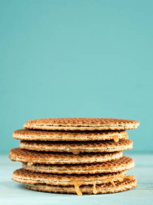 Stroopwafels or caramel Dutch Waffles Stroopwafels or caramel Dutch Waffle close up on turquoise wooden background Copyright: xZoonar.com OlgaxSergeevax 18704832