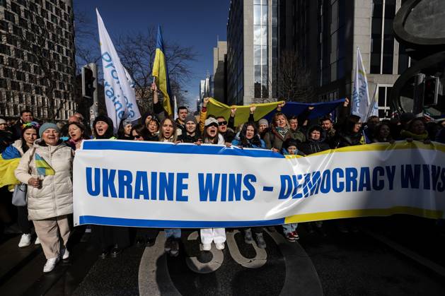 February 25, 2023, Brussels, Brussels Capital Region, Belgium: Demonstrators hold a banner reading Ukraine wins during a demonstration in occasion of the one-year anniversary of Russia s invasion of Ukraine in Brussels, Belgium, February 25, 2023. Brussels Belgium - ZUMAm177 20230225_zip_m177_019 Copyright: xValeriaxMongellix