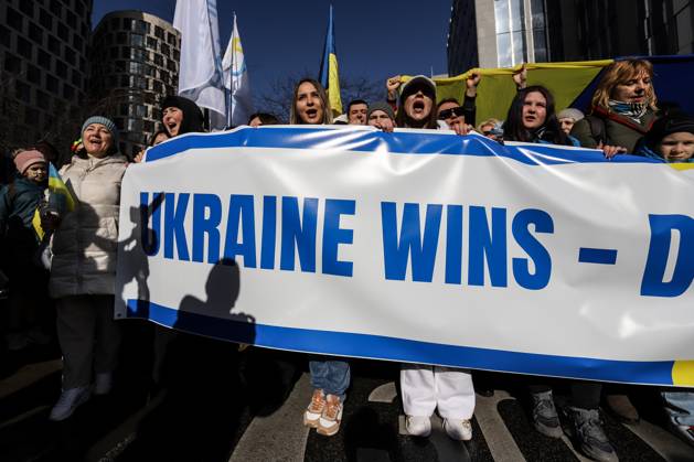 February 25, 2023, Brussels, Brussels Capital Region, Belgium: Demonstrators hold a banner reading Ukraine wins during a demonstration in occasion of the one-year anniversary of Russia s invasion of Ukraine in Brussels, Belgium, February 25, 2023. Brussels Belgium - ZUMAm177 20230225_zip_m177_020 Copyright: xValeriaxMongellix