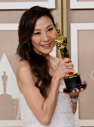 Michelle Yeoh, winner of the award for Best Actress in a Leading Role for Everything Everywhere All at Once, appears backstage with her Oscar during the 95th annual Academy Awards at Loews Hollywood Hotel in the Hollywood section of Los Angeles on Sunday, March 12, 2023.  LAP20230312291 JOHNxANGELILLO