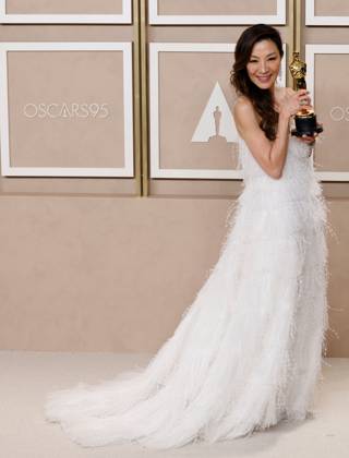 Michelle Yeoh, winner of the award for Best Actress in a Leading Role for Everything Everywhere All at Once, appears backstage with her Oscar during the 95th annual Academy Awards at Loews Hollywood Hotel in the Hollywood section of Los Angeles on Sunday, March 12, 2023.  LAP20230312292 JOHNxANGELILLO