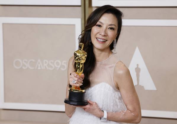 Michelle Yeoh, winner of the award for Best Actress in a Leading Role for Everything Everywhere All at Once, appears backstage with her Oscar during the 95th annual Academy Awards at Loews Hollywood Hotel in the Hollywood section of Los Angeles on Sunday, March 12, 2023.  LAP202303125009 JohnxAngelillo