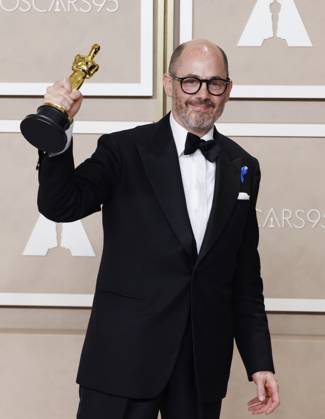 Edward Berger, winner of the award for Best International Feature Film for All Quiet on the Western Front, appears backstage with his Oscar during the 95th annual Academy Awards at Loews Hollywood Hotel in the Hollywood section of Los Angeles on Sunday, March 12, 2023.  LAP202303128128 JohnxAngelillo