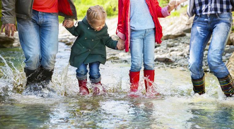 Happy family wearing rain boots jumping into a mountain river Happy family with two children wearing rain boots jumping into a mountain river ,model released, Symbolfoto Copyright: xZoonar.com DashaxPetrenkox 7381519 ,model released, Symbolfoto ,property released