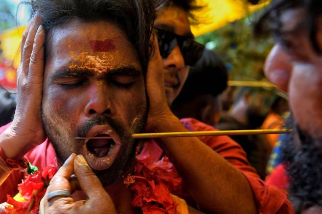 April 6, 2023, Bandel, India: A devotee seen getting pierced by a vel spear (also known as a divine javelin) during the Vel Vel religious festival in West Bengal. Velvel is a Hindu festival dedicated to the Hindu God Murugan Mutthumariamman and is celebrated in the month of April. Devotees perform different painful rituals, often involving piercing, with a belief that God Murugan Mutthumariamman will save their family members from all evil powers for next one year. Bandel India - ZUMAs197 20230406_zaa_s197_318 Copyright: xAvishekxDasx