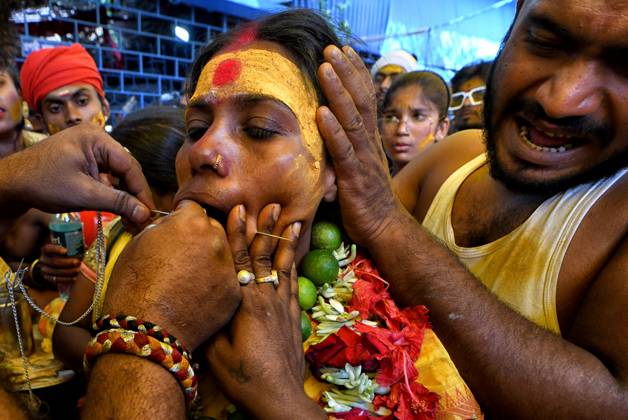 April 6, 2023, Bandel, India: A woman devotee seen getting pierced by a vel spear (also known as a divine javelin) during the Vel Vel religious festival in West Bengal. Velvel is a Hindu festival dedicated to the Hindu God Murugan Mutthumariamman and is celebrated in the month of April. Devotees perform different painful rituals, often involving piercing, with a belief that God Murugan Mutthumariamman will save their family members from all evil powers for next one year. Bandel India - ZUMAs197 20230406_zaa_s197_331 Copyright: xAvishekxDasx