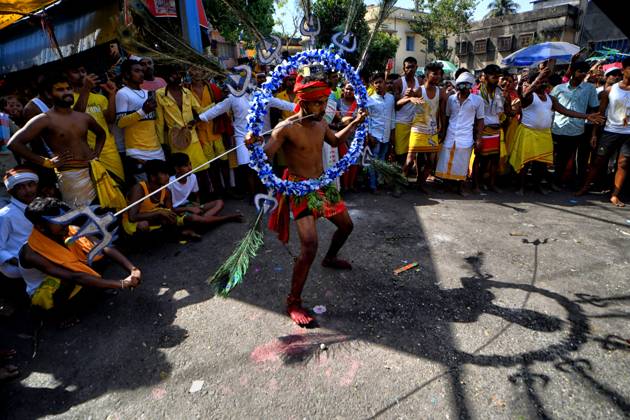 April 6, 2023, Bandel, India: A devotee performs religious activities during a religious procession to mark Bhel Bhel festival dedicated to Hindu goddess Muthumariamman in Bandel town in the eastern state of West Bengal, 55 Km (Approx) away from Kolkata. Velvel is a Hindu festival dedicated to the Hindu God Murugan Mutthumariamman and is celebrated in the month of April. Devotees perform different painful rituals, often involving piercing, with a belief that God Murugan Mutthumariamman will save their family members from all evil powers for next one year. Bandel India - ZUMAs197 20230406_zaa_s197_315 Copyright: xAvishekxDasx