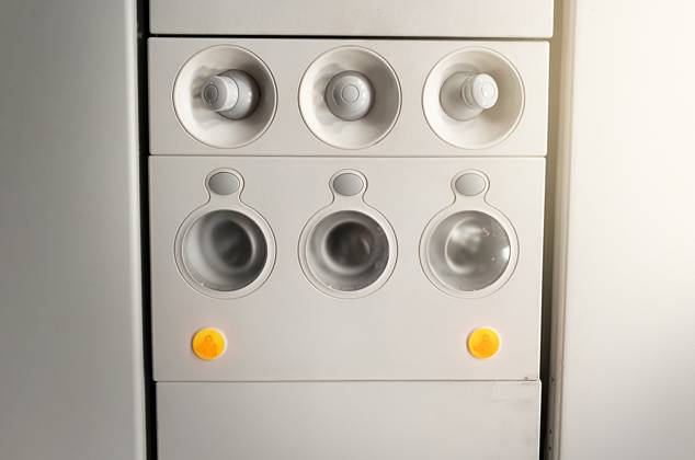 Adjustable lights and air conditioners overhead seat controls of a commercial aircraft in an airplane Adjustable lights and air conditioners overhead seat controls of a commercial aircraft. Closed air conditioners nozzles Copyright: xZoonar.com ValerioxRosatix 14732071
