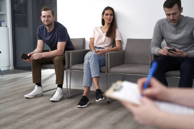 Men and women sitting in waiting room at clinic model released, Symbolfoto property released, ABIF01846