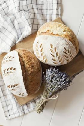 Freshly baked bread with dry lavender flowers on table property released, ONAF00484