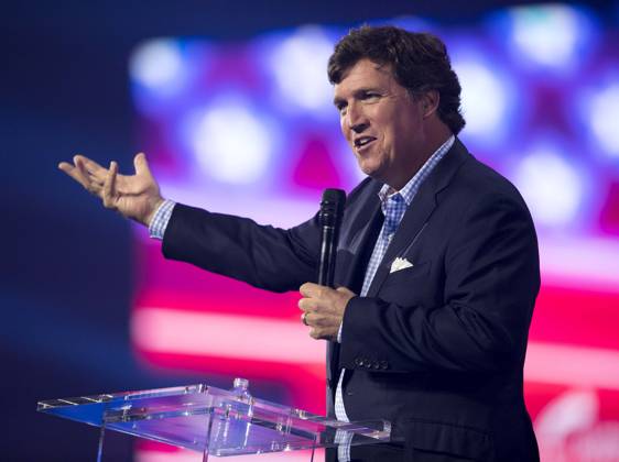 December 17, 2022, Phoenix, Arizona, USA: Fox News host TUCKER CARLSON speaks at Turning Point USA s AmericaFest 2022. Phoenix USA - ZUMAce6_ 20221217_zaf_ce6_019 Copyright: xBrianxCahnx