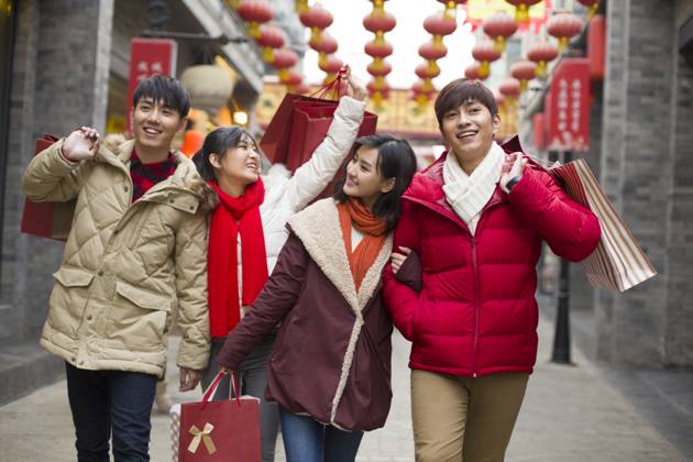 Happy young Chinese friends shopping for Chinese New Year Beijing China Copyright: xLianxFeix bji05210179