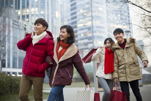 Happy young Chinese friends shopping for Chinese New Year Beijing China Copyright: xLianxFeix bji05210183
