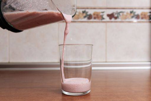 RECORD DATE NOT STATED A beautiful shot of delicious strawberry milk poured in a transparent glass *** einer Schönes erschossen des Köstlich Erdbeere Milch eingeschenkt ÊIn einer durchsichtig Glas 329220